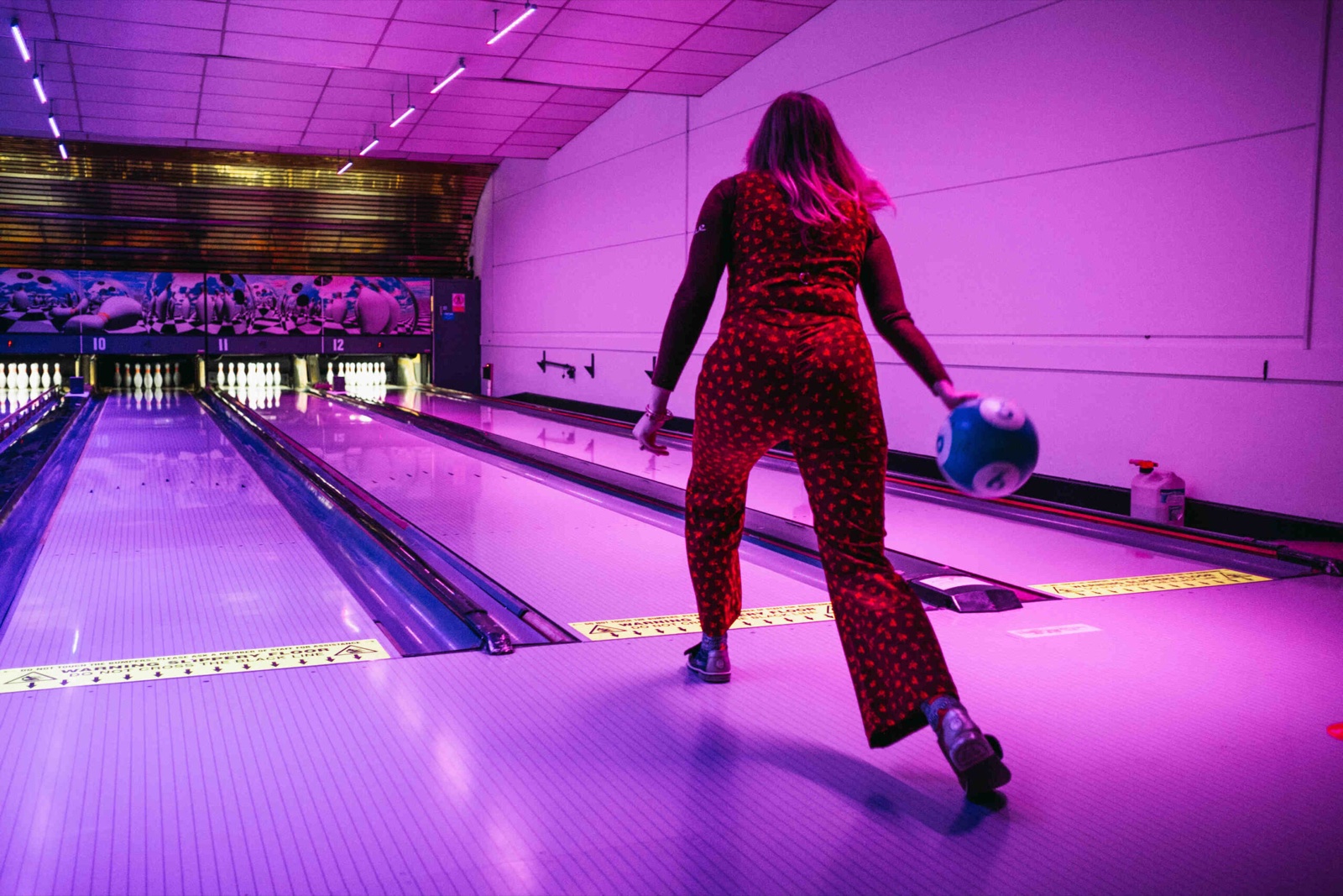 Bowling on the neon-lit lanes at Bugsy’s
