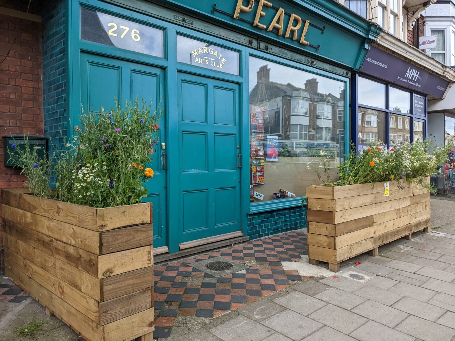 The teal shopfront of Margate Arts Club at 276 Northdown Road