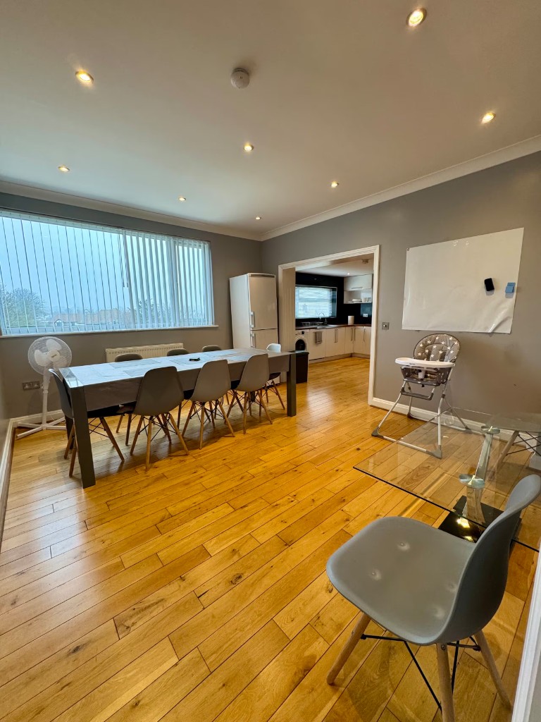 Dining table and kitchen in the flat